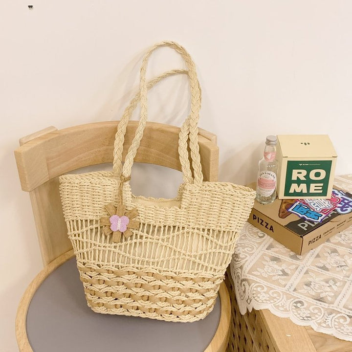Handwoven beach bag with floral accents Kalsten
