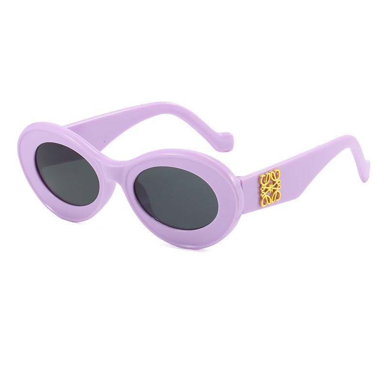 Women's fashionable sunglasses with oval frame and golden applications Kalsten