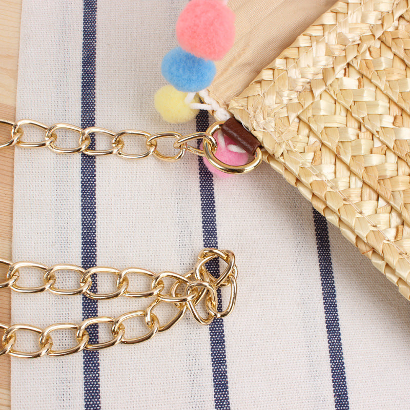 Clutch Bag Made of Handwoven Straw with Decorative Pompons Kalsten