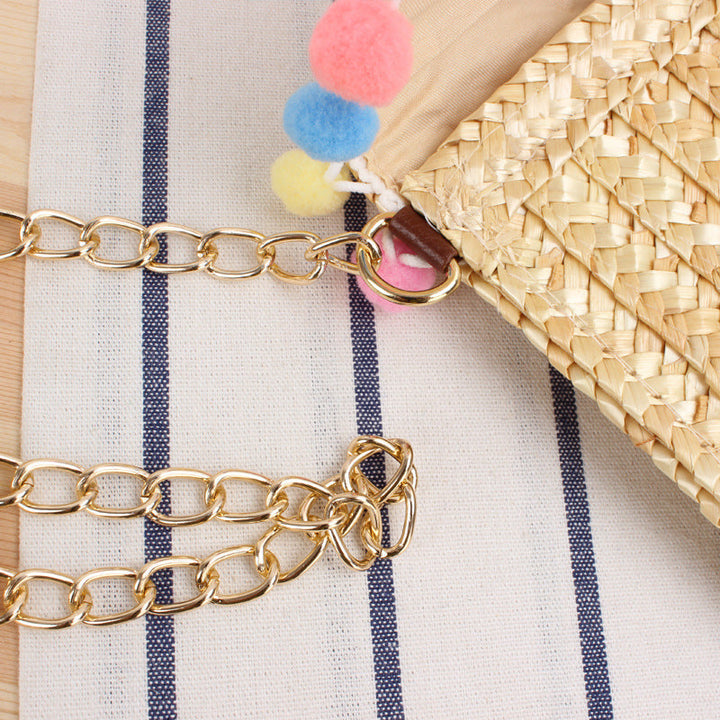 Clutch Bag Made of Handwoven Straw with Decorative Pompons Kalsten
