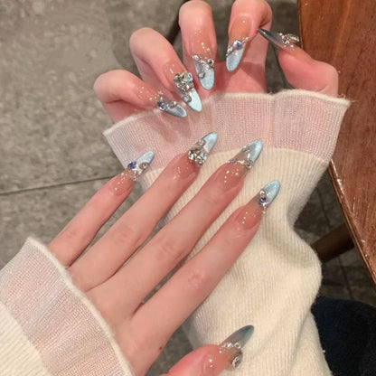 Acrylic nail set with elegant tips and glamorous rhinestone accents Acalora