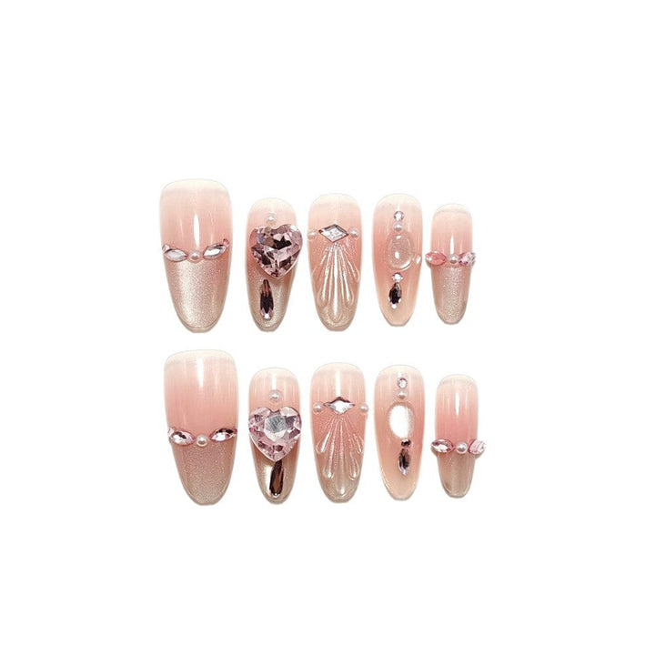Artificial nails with sparkling heart and rhinestone accents Kalsten