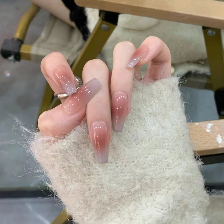 Glamorous artificial nails with delicate flower and glitter effects Kalsten