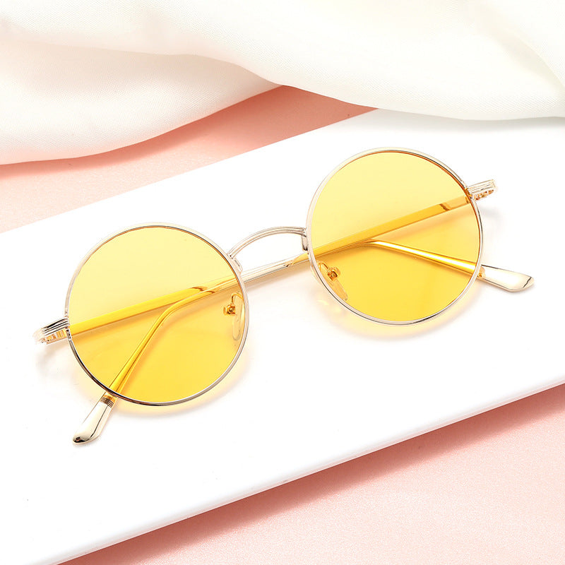 Ladies fashionable glasses with round lenses and fine metal frame Kalsten