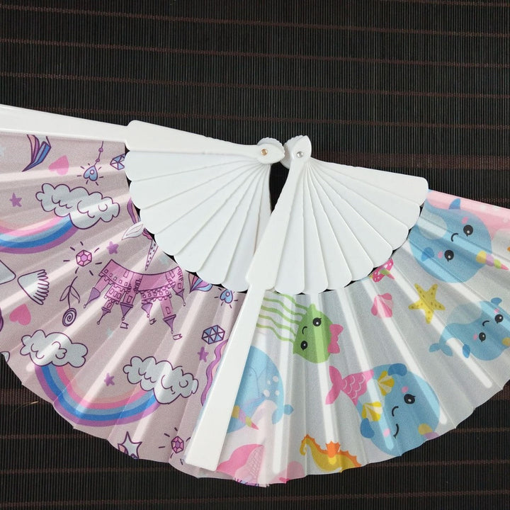 Women folding hand fan with shimmering scale pattern Kalsten