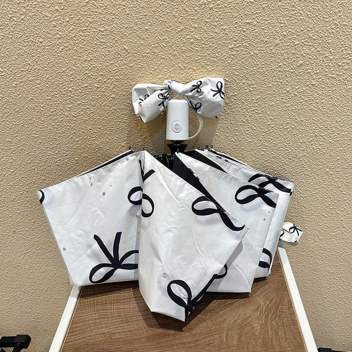 Women's foldable umbrella with elegant bow design Kalsten
