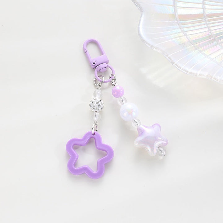 Playful keychain with floral and star motif Kalsten