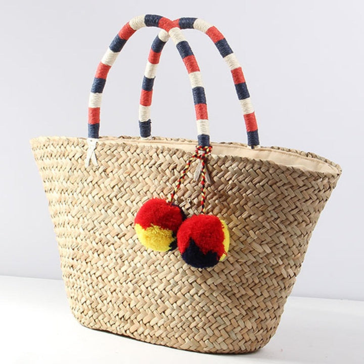 Braided beach bag with decorative pompons Kalsten