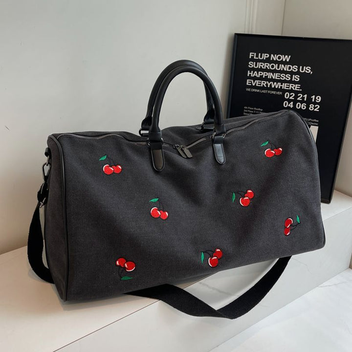 Sporty weekend bag with playful cherry pattern Kalsten