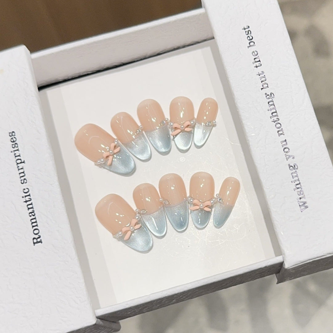 Artificial nail set with romantic bow and glitter accents Kalsten