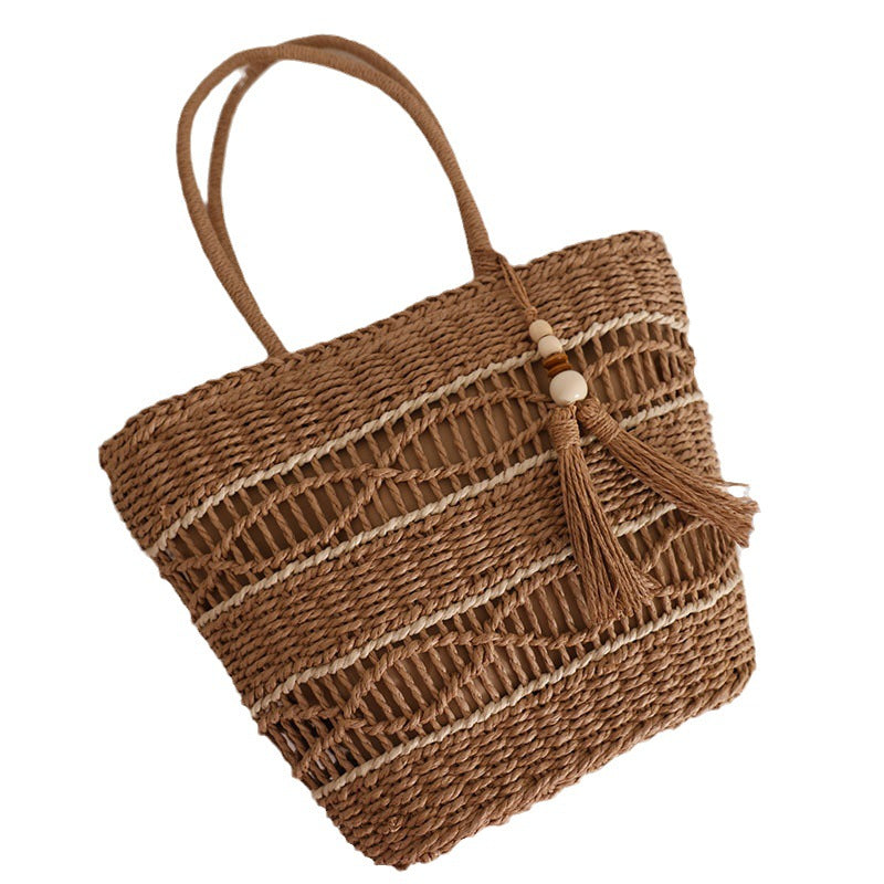 Handcrafted straw tote bag with decorative tassel detail Kalsten