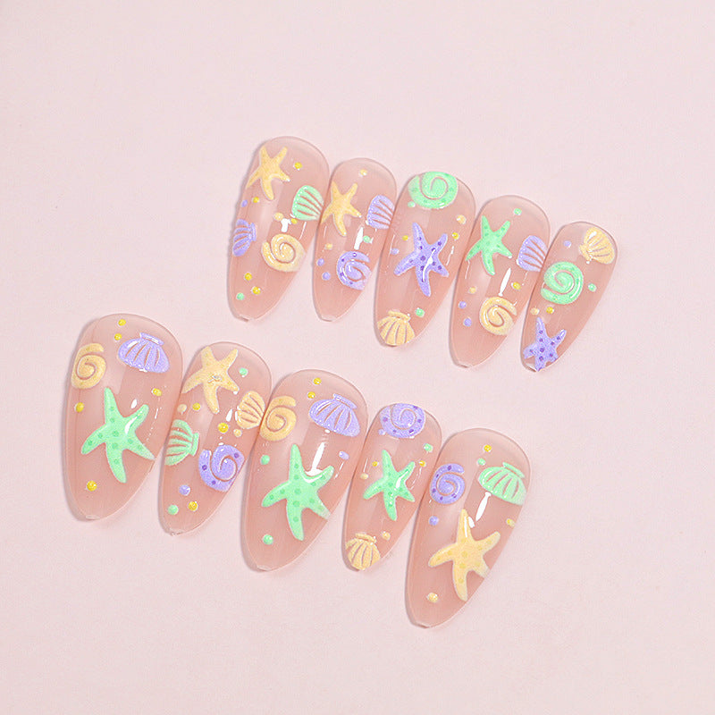 Artistic Press-On Nail Design with Ocean-Inspired Accents Kalsten