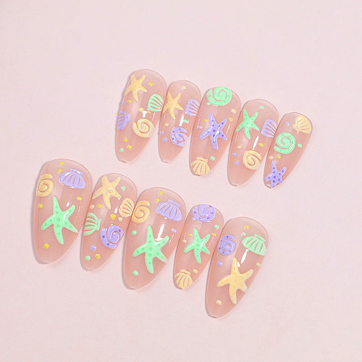 Artistic Press-On Nail Design with Ocean-Inspired Accents Kalsten
