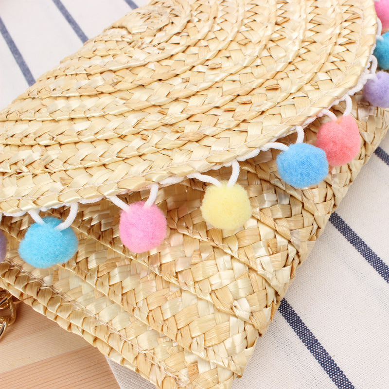 Clutch Bag Made of Handwoven Straw with Decorative Pompons Kalsten