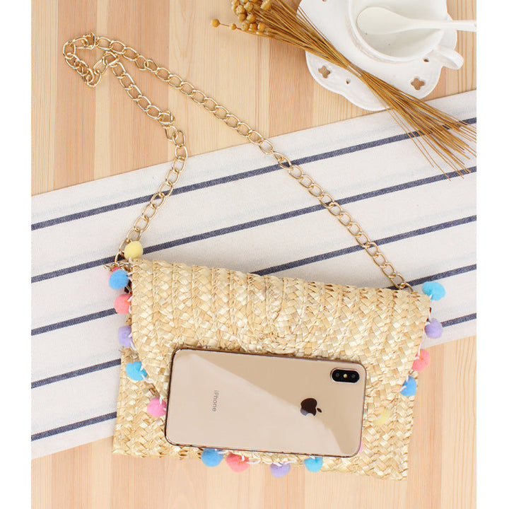 Clutch Bag Made of Handwoven Straw with Decorative Pompons Kalsten