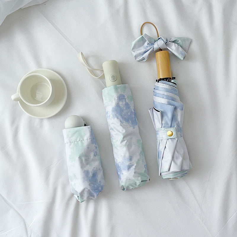 Ladies elegant folding umbrella with modern cloud pattern Kalsten
