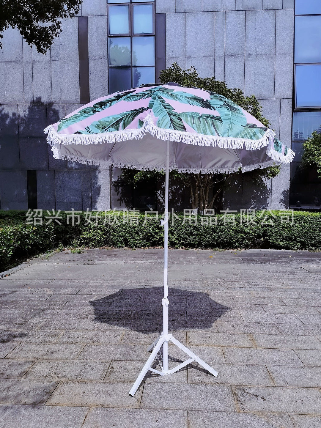 Ladies sun umbrella with tropical leaf design and tassel decoration Kalsten