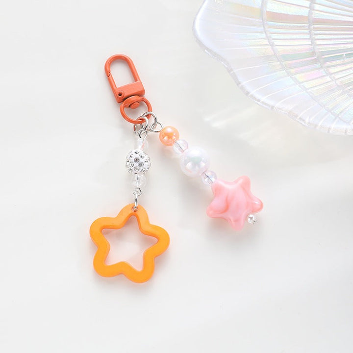 Playful keychain with floral and star motif Kalsten