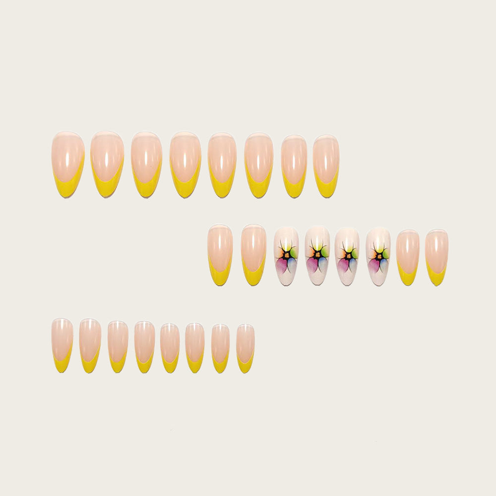 Stylish artificial nails with floral accents and colorful French tip design Kalsten