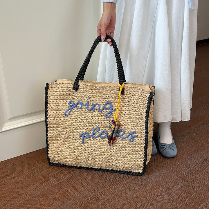 Leisure bag made of woven natural material with colorful pendant Kalsten
