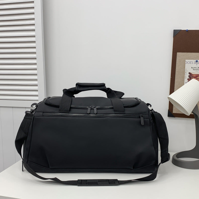 Sporty travel bag with reinforced carrying handles and multiple compartments Kalsten