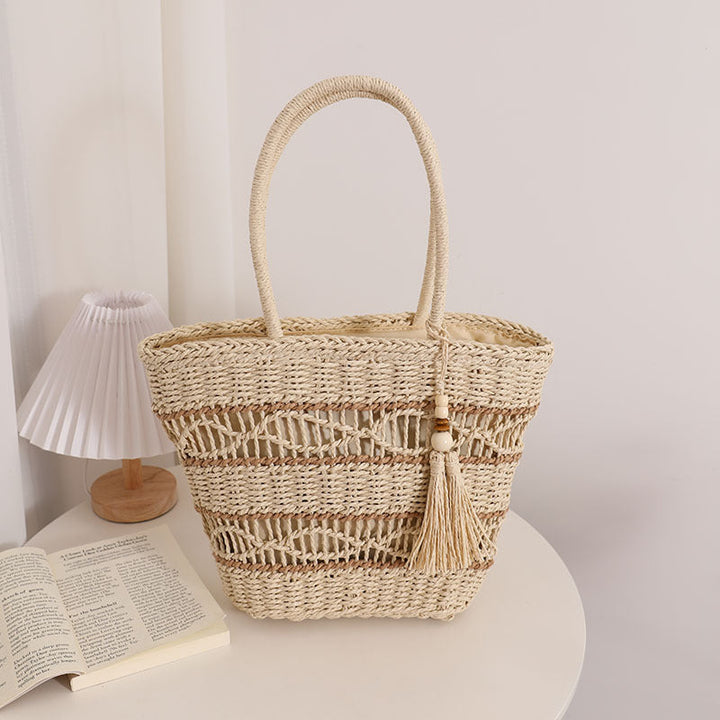 Handcrafted straw tote bag with decorative tassel detail Kalsten