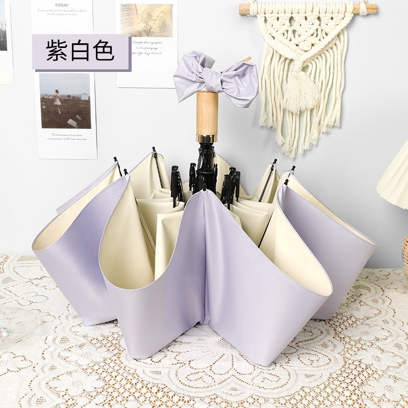 Ladies elegant folding umbrella in portrait format with stylish wooden handle Kalsten
