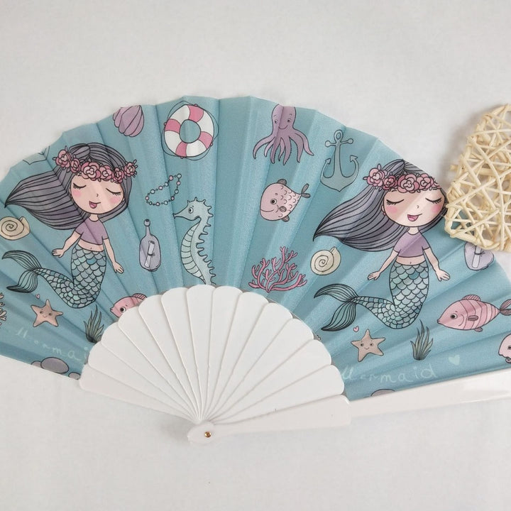 Women folding hand fan with shimmering scale pattern Kalsten