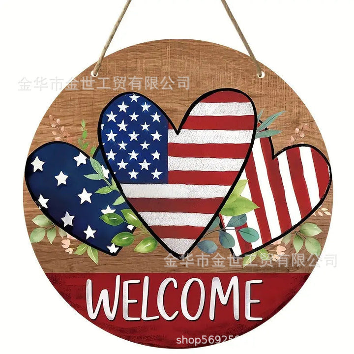 Independence Day rustic round wooden patriotic cross wall plaque with floral accents and God Bless America banner Kalsten