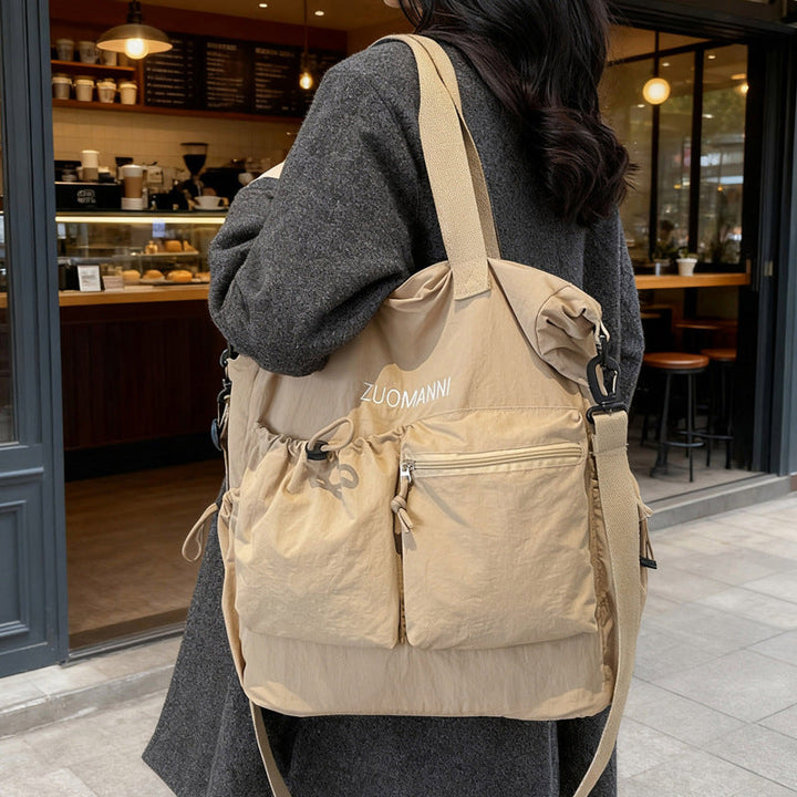 Tote bag with multifunctional outer pockets and adjustable shoulder strap Kalsten