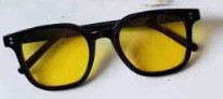 Women striking retro sunglasses with yellow-tinted lenses Kalsten