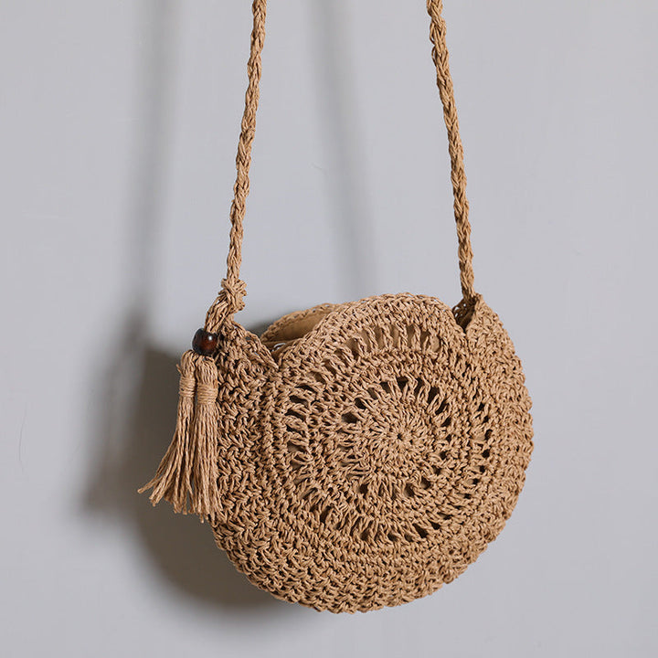 Round bag made of natural jute material with trendy fringe detail Kalsten