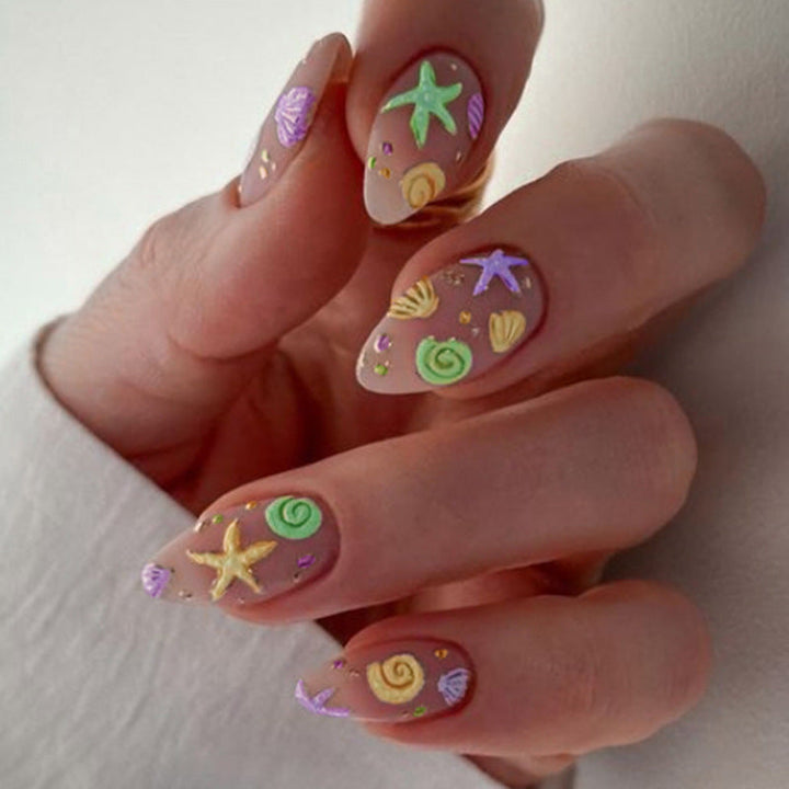 Artistic Press-On Nail Design with Ocean-Inspired Accents Kalsten
