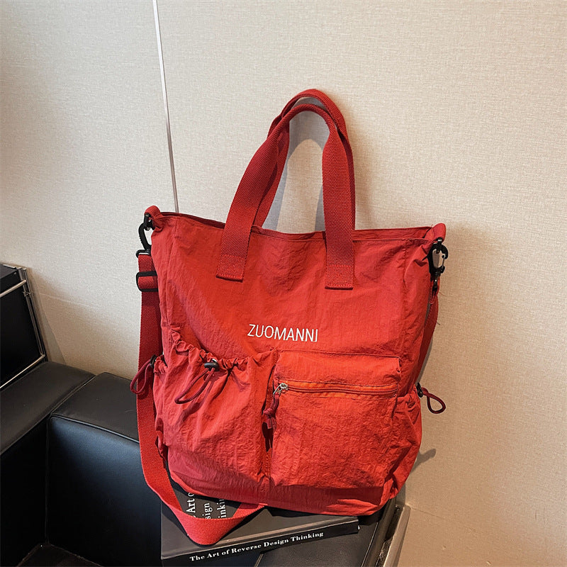 Tote bag with multifunctional outer pockets and adjustable shoulder strap Kalsten