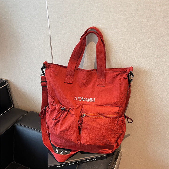 Tote bag with multifunctional outer pockets and adjustable shoulder strap Kalsten