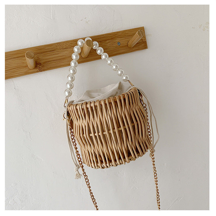 Women’s handbag with elegant pearl handle and braided design Kalsten