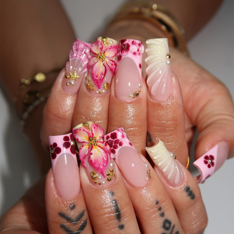 Acrylic nail set with exclusive flower design and sparkling accents Acalora