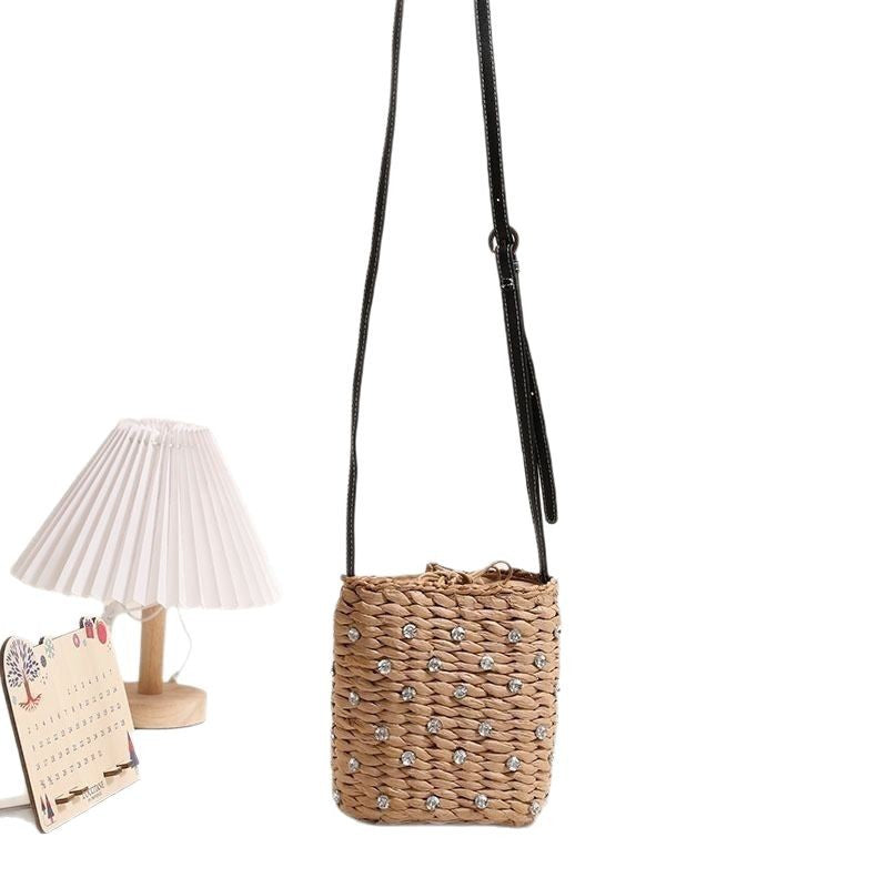 Bag made of woven natural material with sparkling appliqués Kalsten