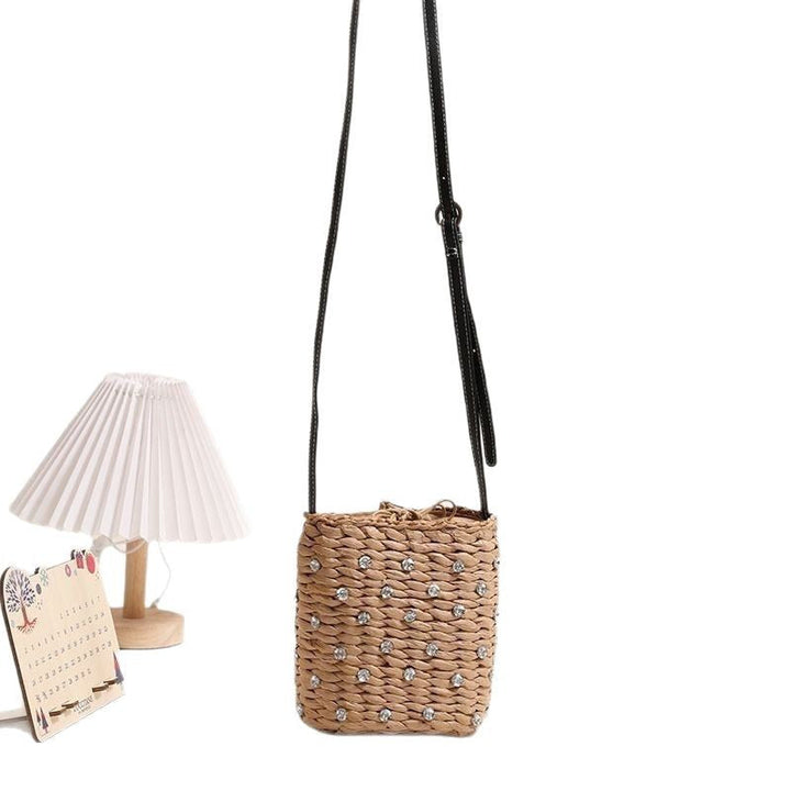 Bag made of woven natural material with sparkling appliqués Kalsten