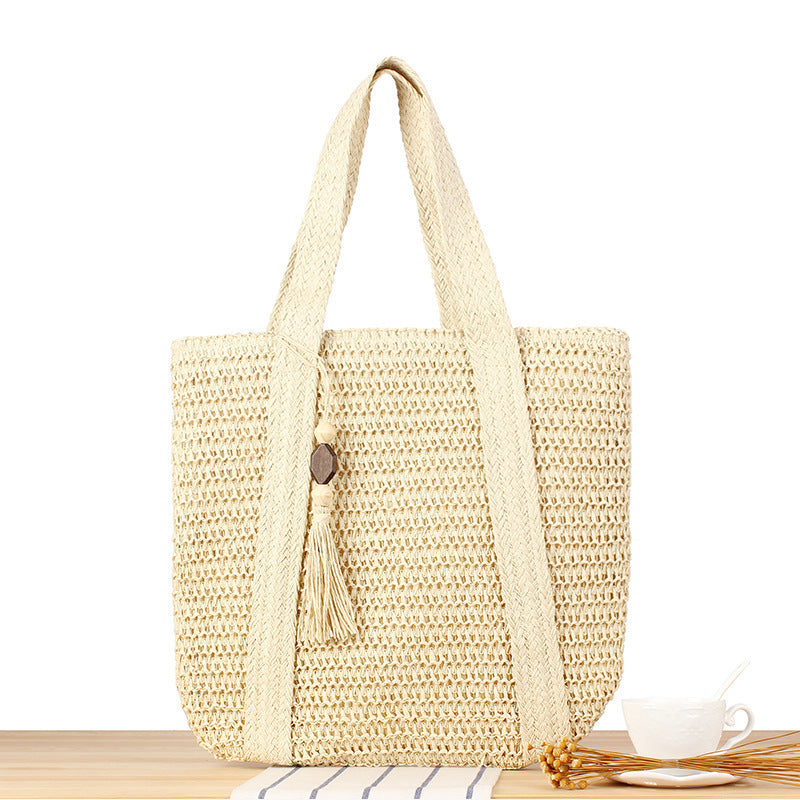 Eco-friendly straw tote bag with elegant tassel detail Kalsten
