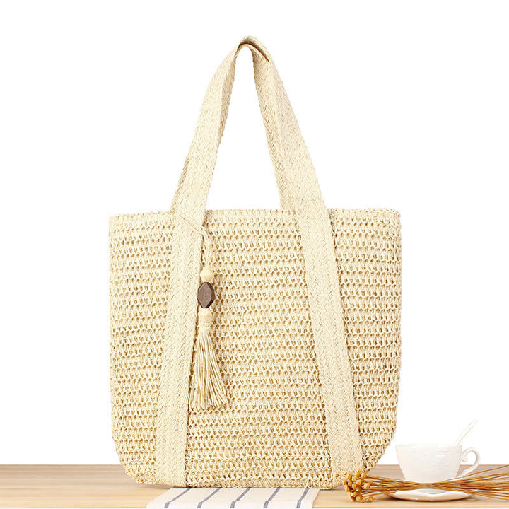 Eco-friendly straw tote bag with elegant tassel detail Kalsten