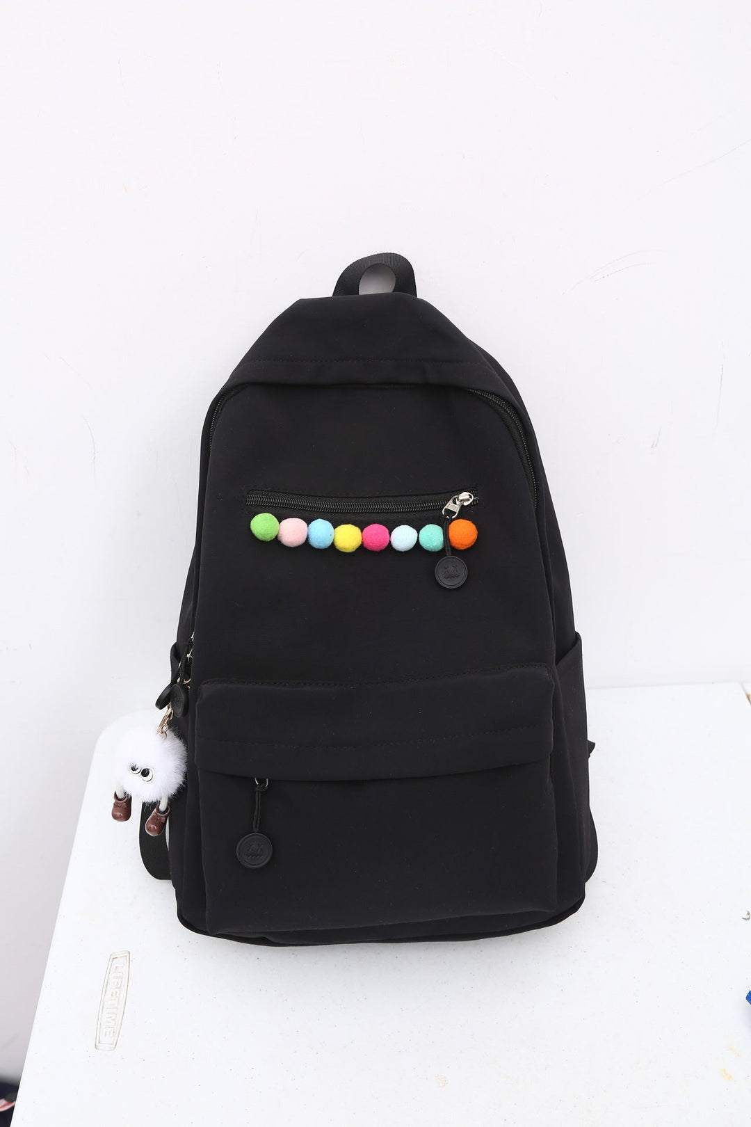 Practical backpack with colorful applications Kalsten