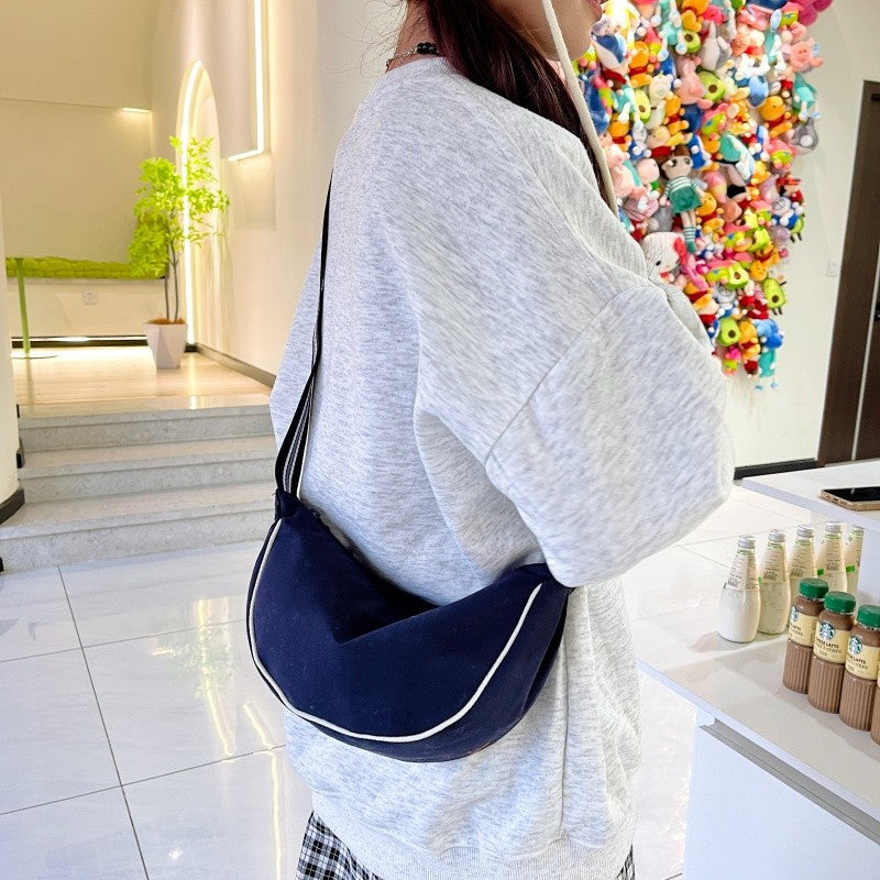Fashionable shoulder bag with unique cut and adjustable strap Kalsten