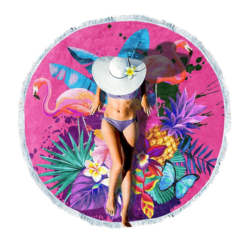 Round beach towel with colorful, tropical floral pattern and fringe decoration Kalsten
