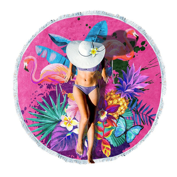 Round beach towel with colorful, tropical floral pattern and fringe decoration Kalsten