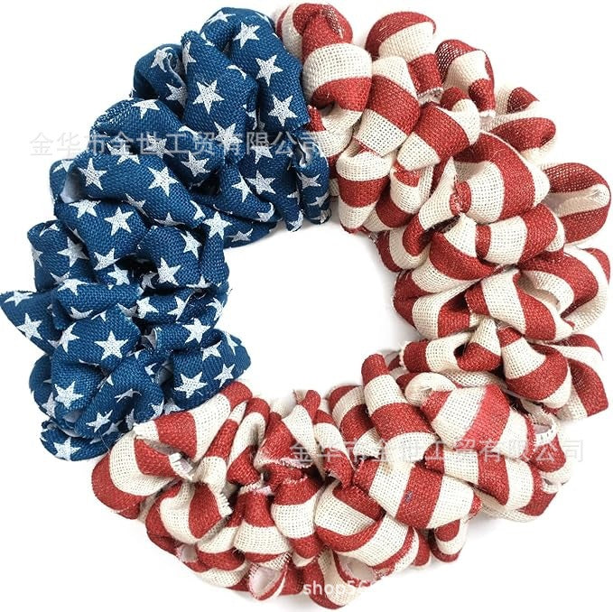 Independence Day rustic round wooden patriotic cross wall plaque with floral accents and God Bless America banner Kalsten
