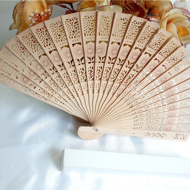 Ladies fan made of delicate plastic with artistic cut pattern Kalsten