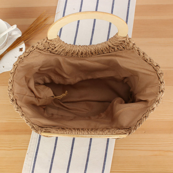 Braided raffia bag with round wooden handles Kalsten