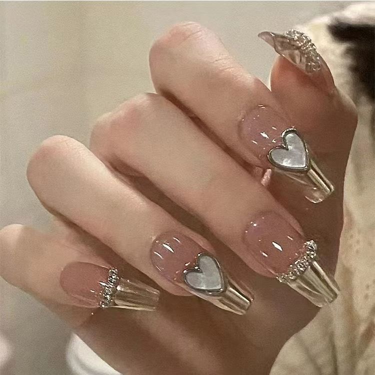 Artificial nails with playful animal motif and elegant French tip design Kalsten