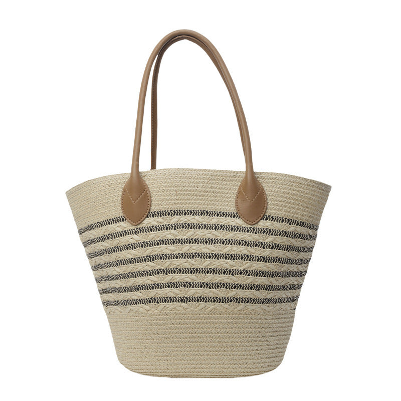 Beach bag made of natural woven material with elegant accents Kalsten